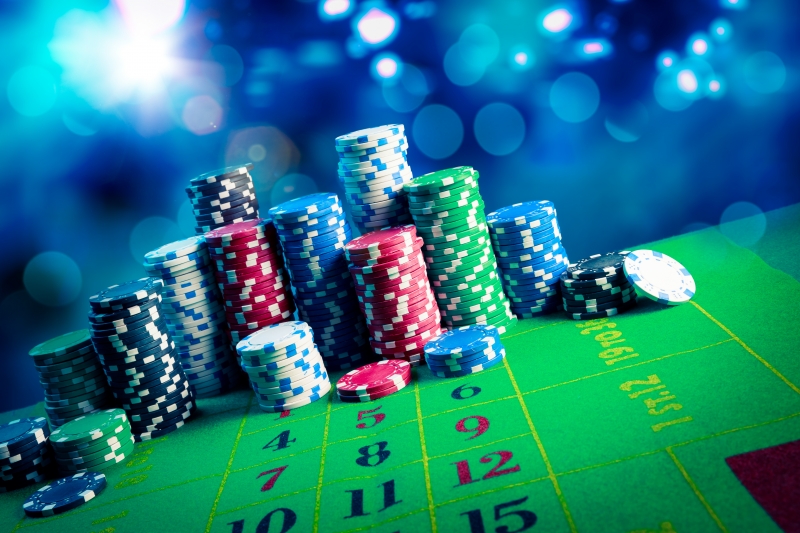 12820797-casino-chips-with-dramatic-lighting-and-lens-flares